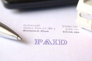 paid-invoice-and-rubber-stamp-on-paper-2022-12-07-05-41-48-utc